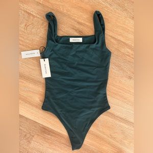 Contour tank thong bodysuit. Never worn. Didn’t match green skirt I purchased.